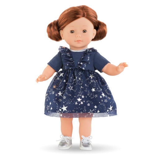Eine Puppe trägt das festliche blaue Kleid mit silbernen Sternen.