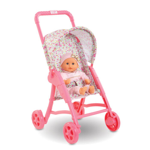 Eine Puppe sitzt im Puppenbuggy.
