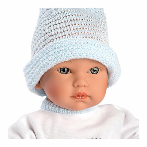Die Detailaufnahme zeigt das Gesicht der kleinen Babypuppe Cuquito.