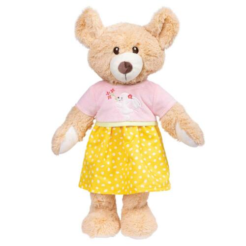 Eine Puppe trägt das Tunika-Kleidchen von Heless.