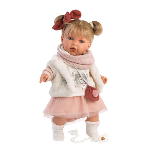 Die Babypuppe Julia trägt ein hübsches Outfit mit Tüllrock und Umhängetasche.