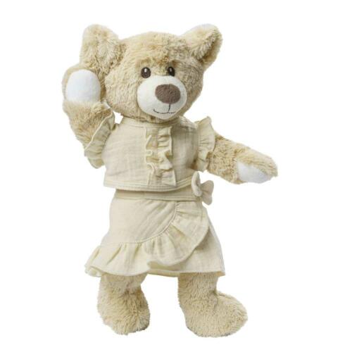 Ein Teddy trägt die niedliche Puppenkleidung.