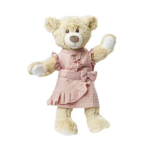 Ein Teddy trägt die niedliche Puppenkleidung.